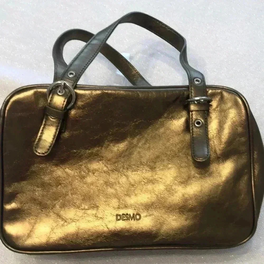Desmo gold leather handbag.